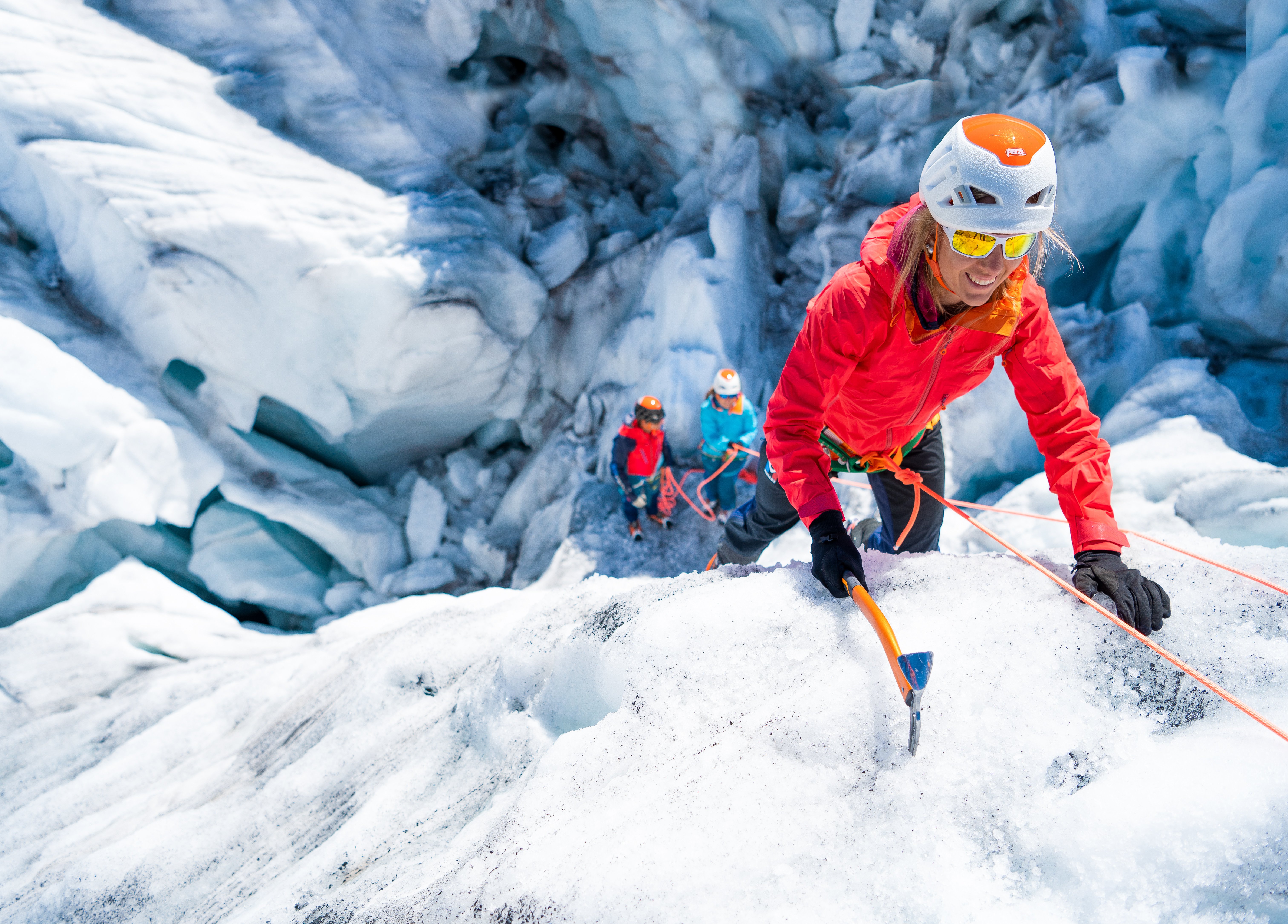 Mountaineer climbing with ice axe