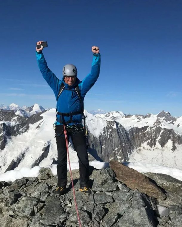 Climber on summit of Schreckhorn