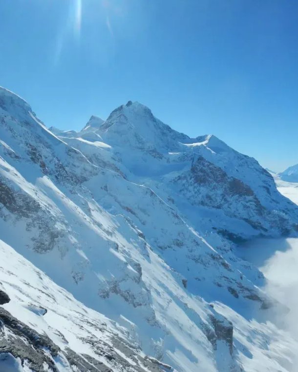 View from the Eiger west flank of Jungfrau and sea of fog
