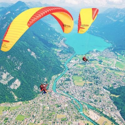 two-paragliders-flying-over-interlaken