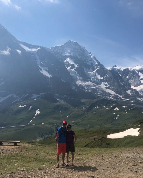Hiker in front of Eiger, Mönch, and Jungfrau