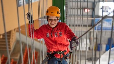 Person climbing securely in the Indoor Rope Park Grindelwald